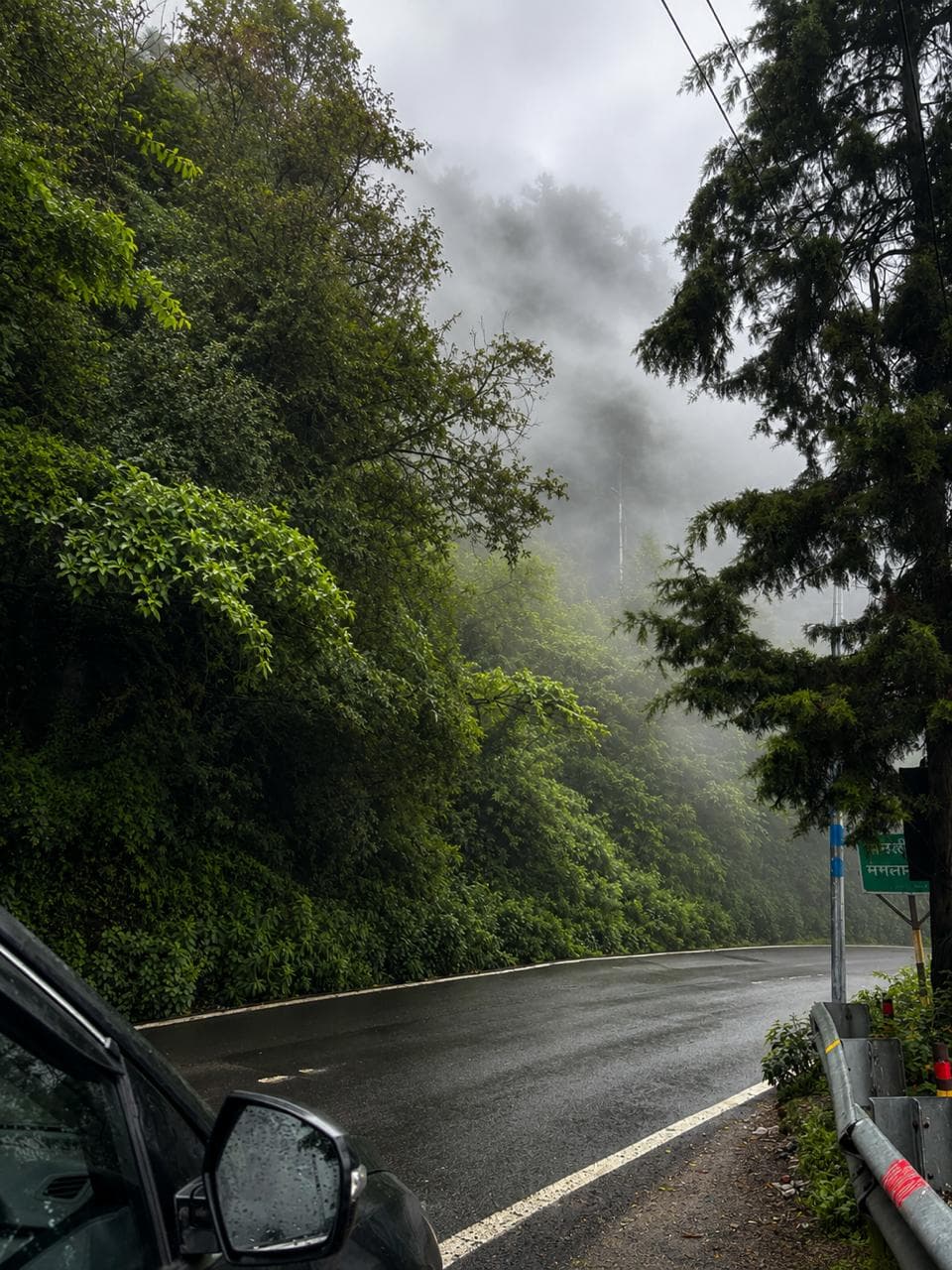 A mountain trail rising through low cloud